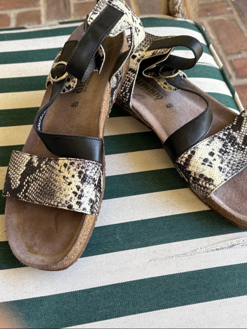 Mephisto strappy sandal with snake print.
Ankle strap is Velcro for easy access.